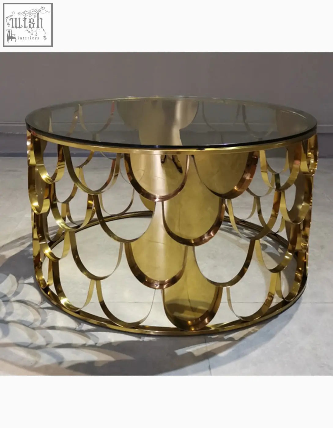 Gold nesting coffee table with scalloped gold metal base and glass top perfect as a stylish gold coffee table