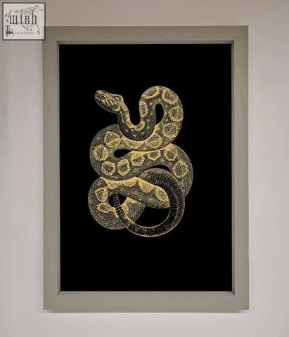 A golden serpent framed wall art featuring a detailed coiled snake illustration in gold and black tones on dark background