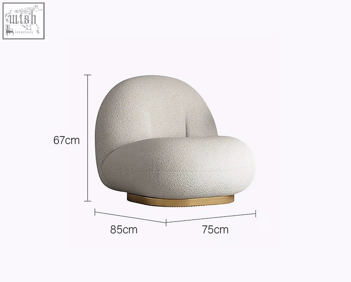 Cream-colored plush boucle armchair with rounded silhouette and gold base from goldie gubi three seater collection
