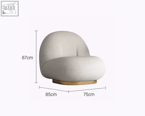 Cream-colored plush boucle armchair with rounded silhouette and gold base from goldie gubi three seater collection