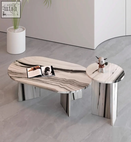 Modern goliah coffee table set with sleek white and black marble top and matching metallic legs for stylish living rooms