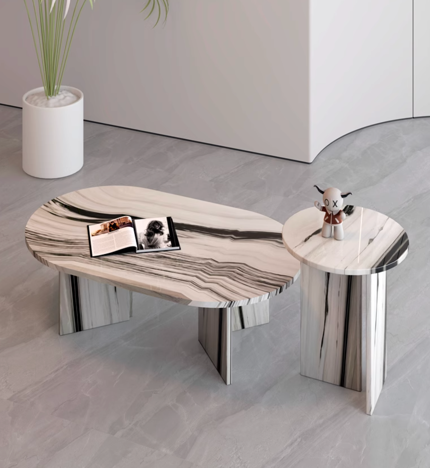 Modern goliah coffee table set with oval white and black marble top and matching metallic legs perfect for living rooms