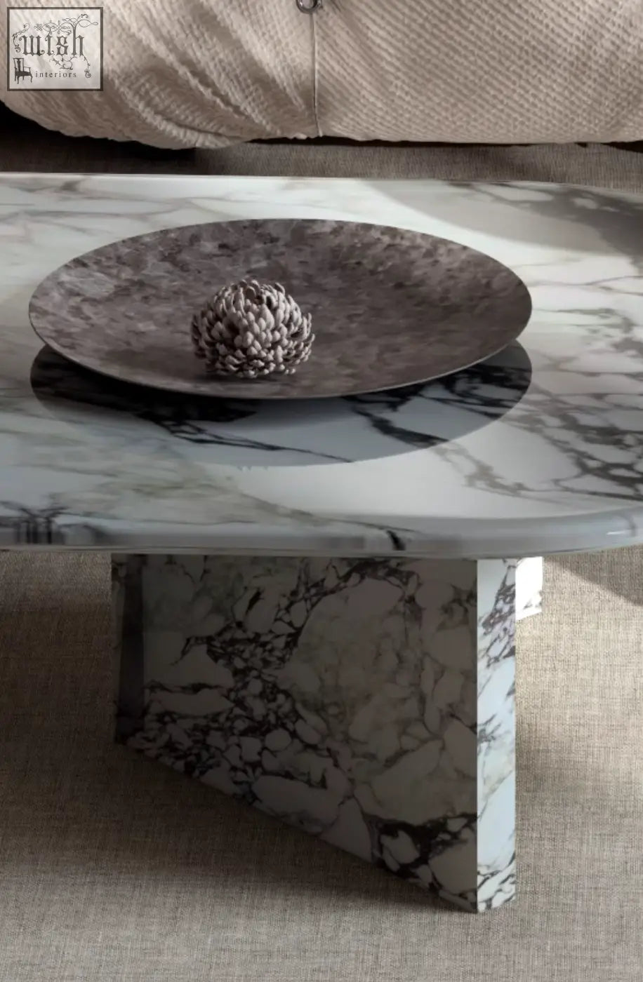 A sleek goliah coffee table set with a white and gray marble top and matching pedestal base for modern living rooms