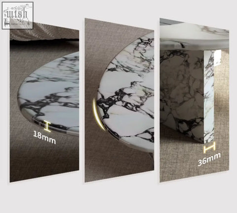 A goliah coffee table set featuring a sleek oval coffee table with polished white and black marble top and base