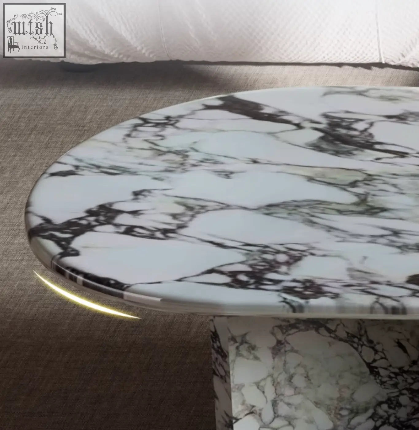A sleek goliah coffee table set with an oval white and black marble top featuring swirling patterns