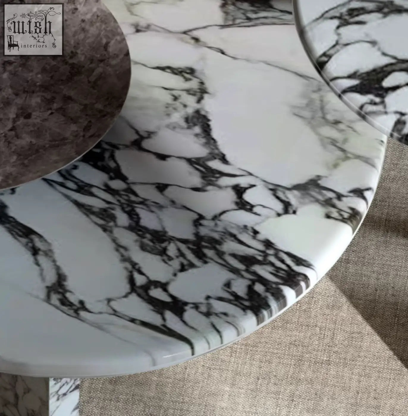 A sleek goliah coffee table set with a round polished white and black marble top perfect as a stylish coffee table