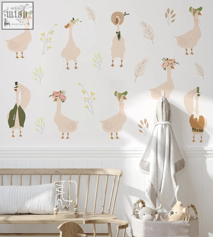 Pastel beige goose nursery wall decals with floral accents and whimsical outfits for nursery wall decoration