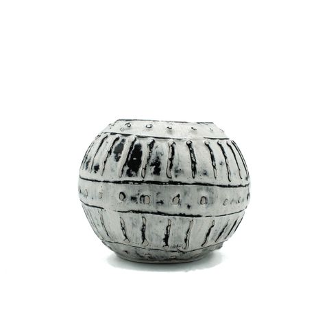 A round matte gray bubble clay plant pot with black vertical ridges perfect for greek bubble clay decor