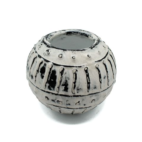 A round handcrafted greek bubble clay plant pot in cream with distressed white glaze and black textured patterns