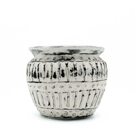 A rustic cream greek clay plant pot with matte silver finish and black textured patterns perfect for plants