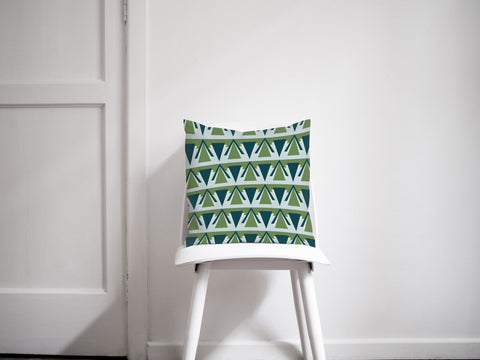 Green and grey art deco design cushion with eye catching geometric pattern of interlocking green and teal triangles