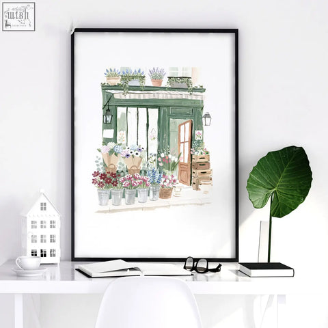 Black-framed green art prints of a flower shop with potted plants perfect for dining room wall decor