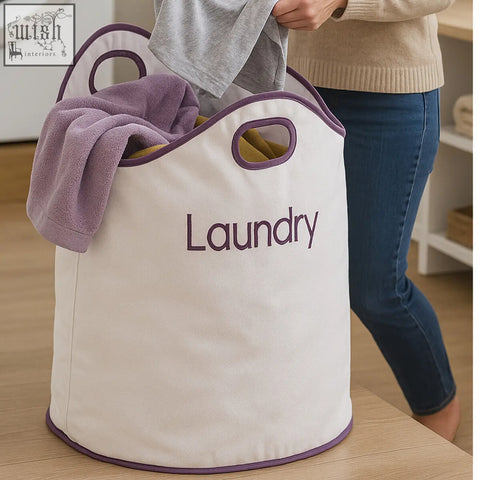 Cream-colored green loop white and purple laundry bag with large opening and purple trim embroidered laundry text