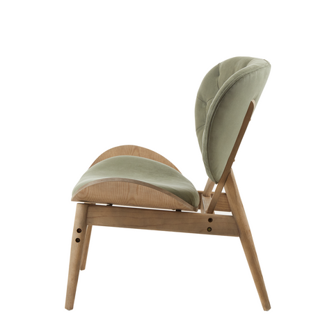 A modern green velvet chair with light green upholstery and slender grey elm wood frame by vinsi