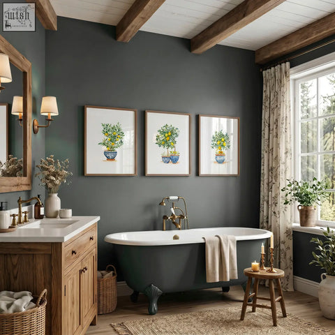 Dark green clawfoot bathtub with white interior and brass fixtures in green wall art lemon tree watercolor prints set of 3