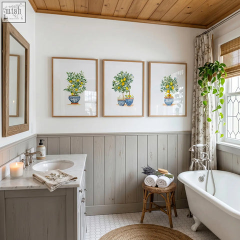 Three framed green wall art prints featuring lemon tree illustrations in blue ceramic pots with light wood frames