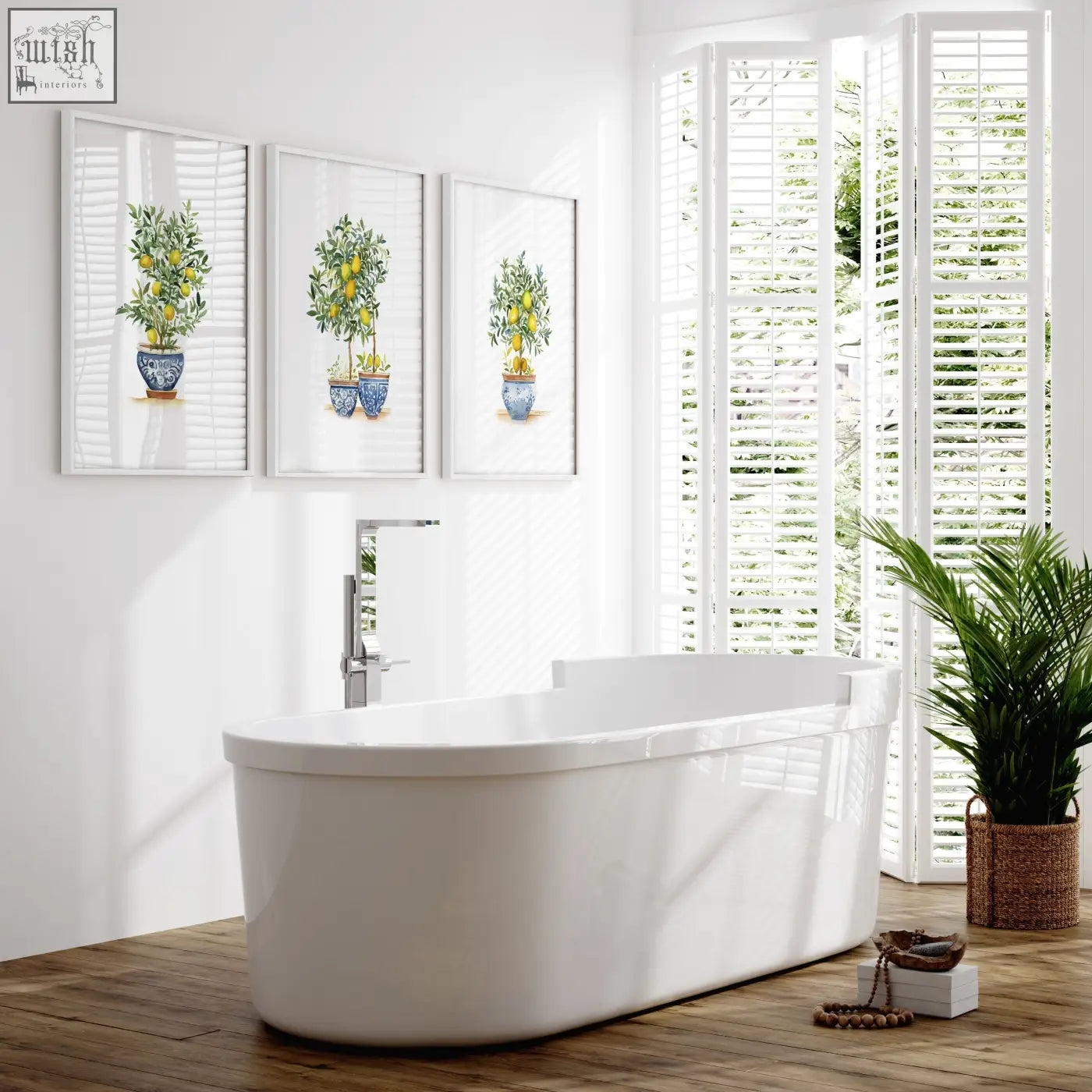 White freestanding bathtub with sleek modern design shown next to green wall art lemon tree french country prints set of 3
