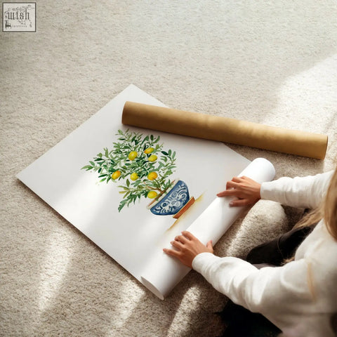 A watercolor lemon tree in a blue and white pot on white paper roll green wall art for french country style