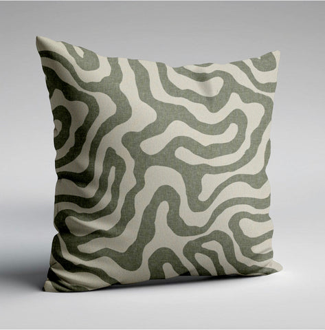 A green wiggle throw cushion with olive green and cream wavy lines on textured fabric perfect for scatter cushions