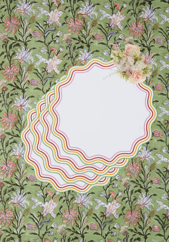 Green with envy tablecloth with floral print and delicate scalloped-edged notepad featuring rainbow-striped border