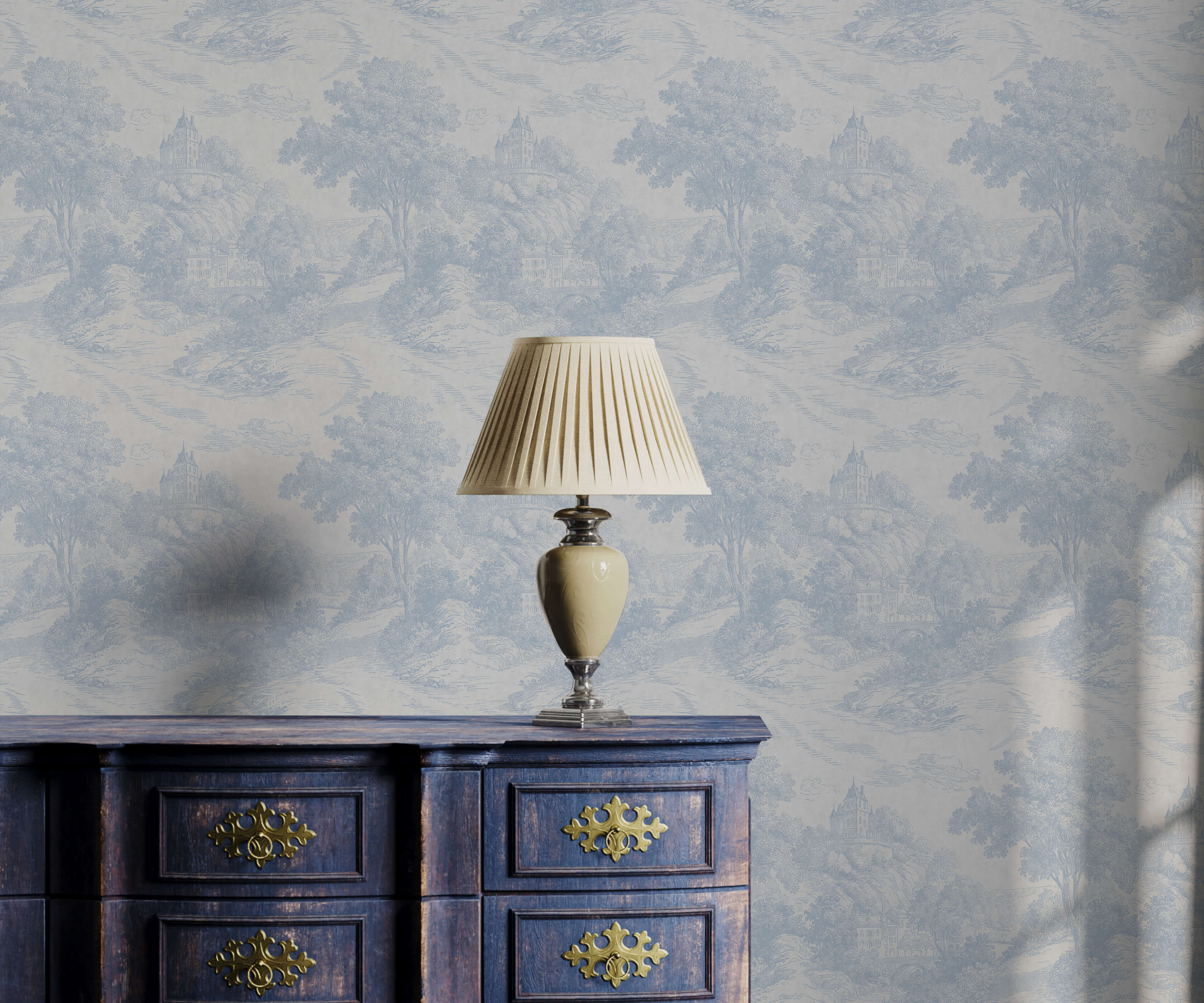 Gregory cream pleated lampshade on ceramic base with metallic accents on antique blue dresser near toile pattern wallpaper