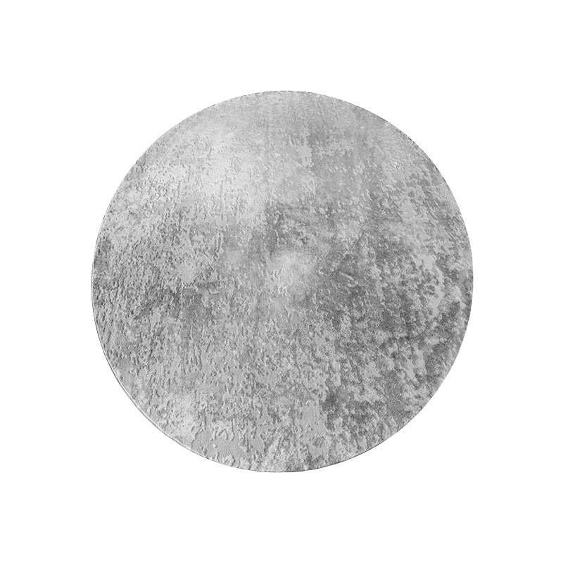 Circular grey and white moon rug with textured mottled finish available in various styles for home decor