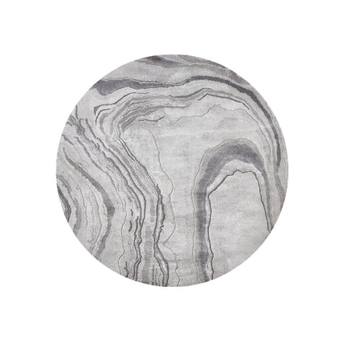 Circular grey and white marble patterned area rug called grey and white moon rug perfect as a white moon rug option