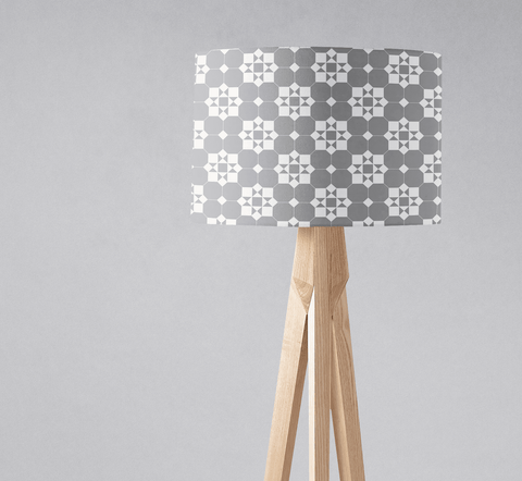 A modern tripod floor lamp with a gray and white tiles design geometric lampshade fabric and inch diameter shade