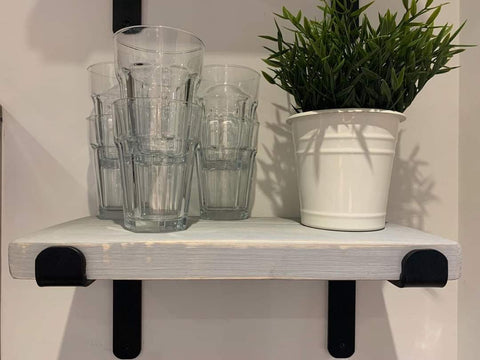 Stack of clear ribbed glass tumblers on a grey wall wooden industrial shelf with free UK delivery