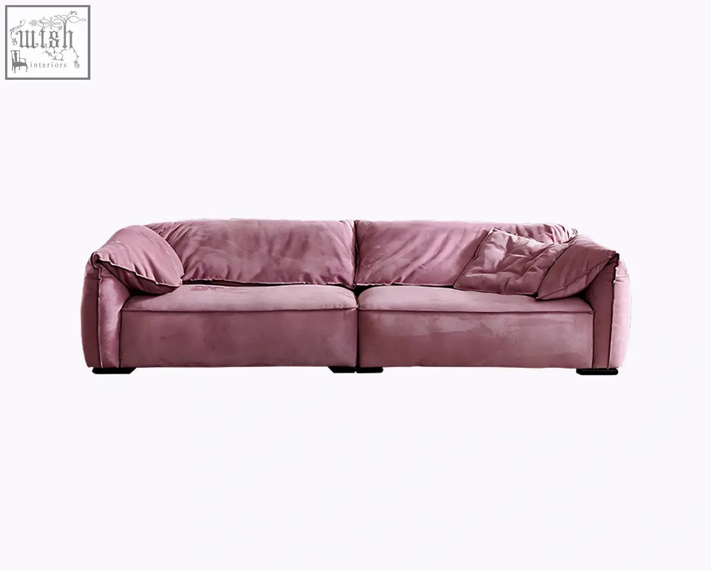 A grimm three seater sofa in dusty rose velvet with modern design and matching throw pillows perfect for living rooms