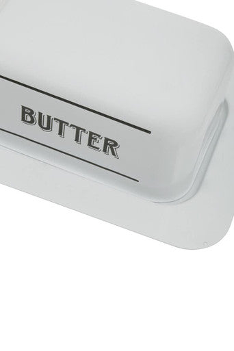 White metal butter dish with sleek rectangular design and black butter lettering on white ceramic top