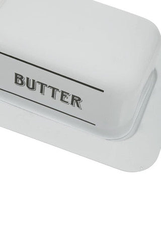 White metal butter dish with sleek rectangular design and black butter lettering on white ceramic top