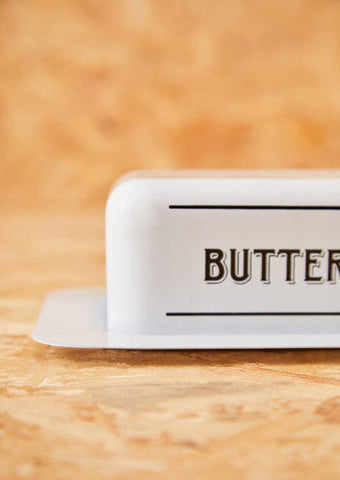 White metal butter dish with minimalist design and black butter lettering for stylish kitchen storage