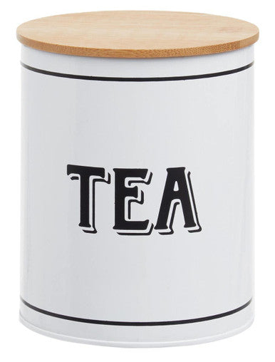 White metal tea canister grocer with a white cylindrical body natural wood lid and black trim for tea storage