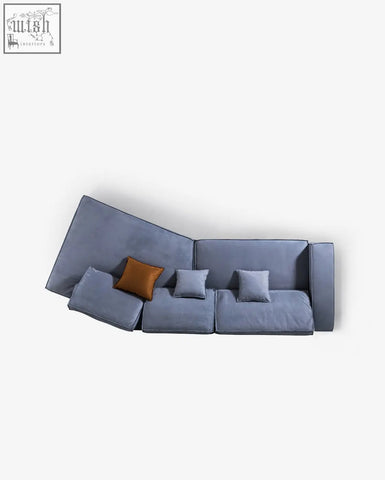 Modern gray velvet grover three seater sofa with brown accent pillow perfect as a stylish corner sofa