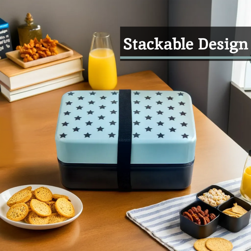 Light blue grub tub light two-tier bento box with star patterned lid and central strap for easy carrying