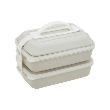 Stacked beige grub tub lunch box in warm grey with white lid and handle made of plastic for easy carrying