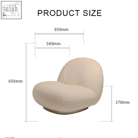 Cream-colored gubi pacha lounge chair with plush boucle upholstery and modern gold base perfect as an accent chair