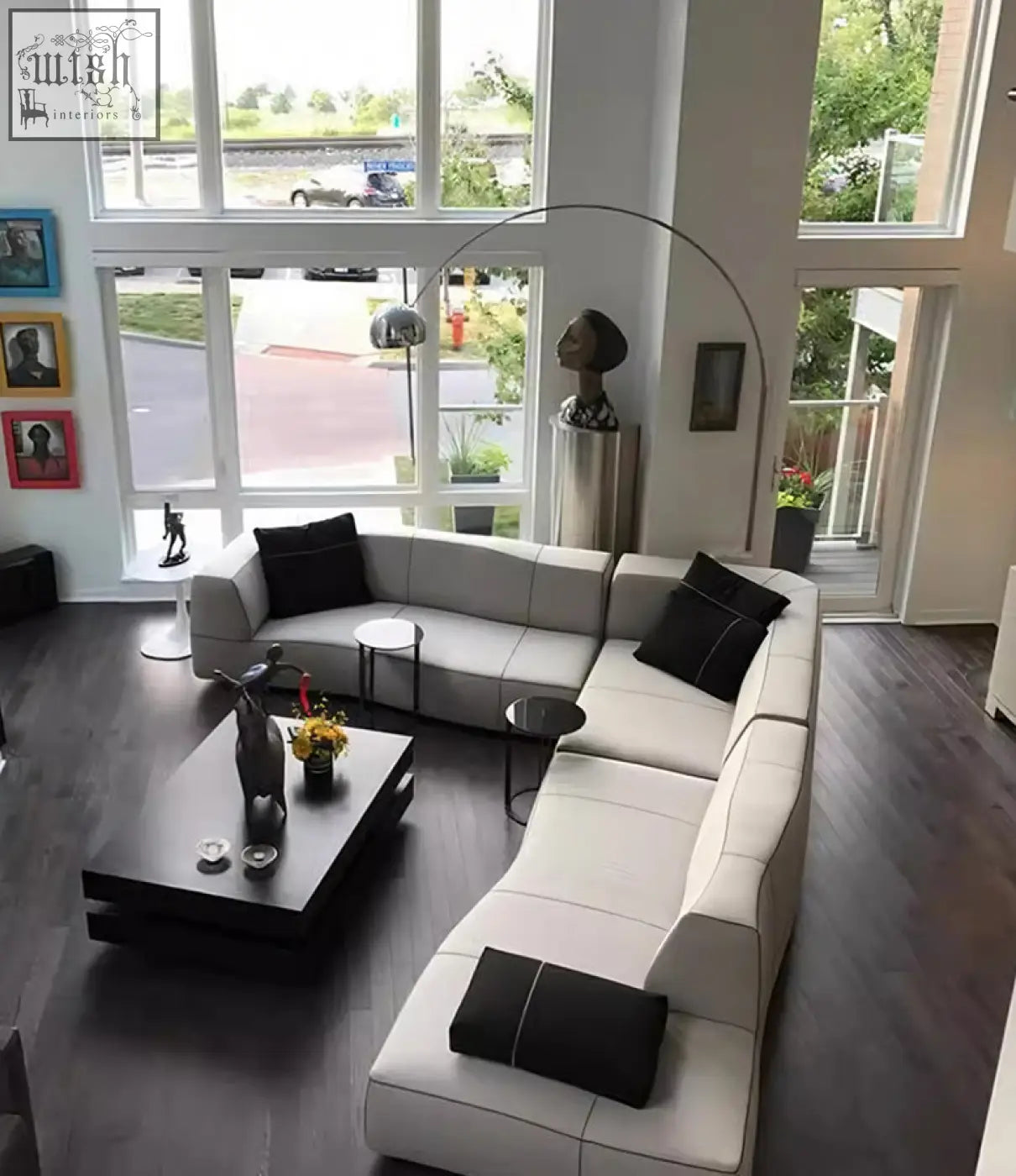 Modern off-white guzman velvet corner sofa with black accent pillows featuring a sleek minimalist design