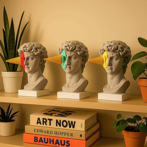 Three gray marble like haagen david sculpture busts with colorful ice cream cones from art history theme