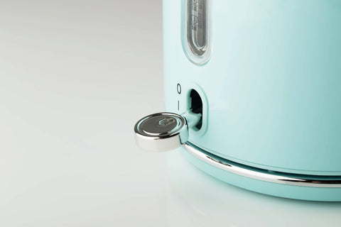 A sleek mint green haden heritage blue retro kettle with stainless steel body rapid boil and water level window