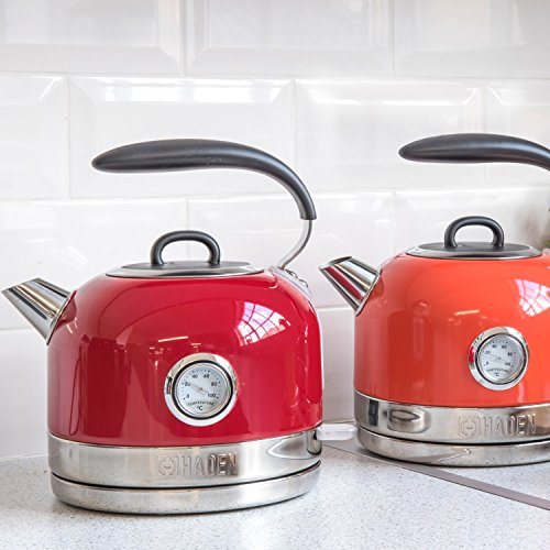 Red kettle with stainless steel body and chrome accents featuring rapid boil temperature gauge and indicator light