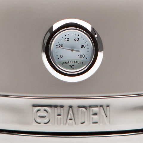 A sleek silver haden stainless steel thermometer with a circular dial highlighting safety features and rapid boil technology