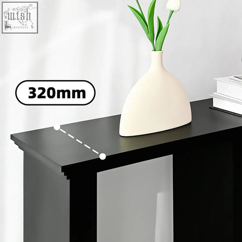 Cream-colored ceramic vase with sleek modern design on white hadza u shape console table with smooth surface
