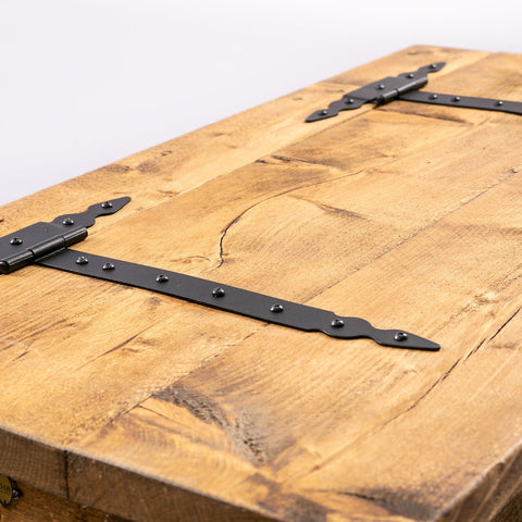 Rustic wooden blanket box trunk with black metal hinges and decorative studs for hairpin storage