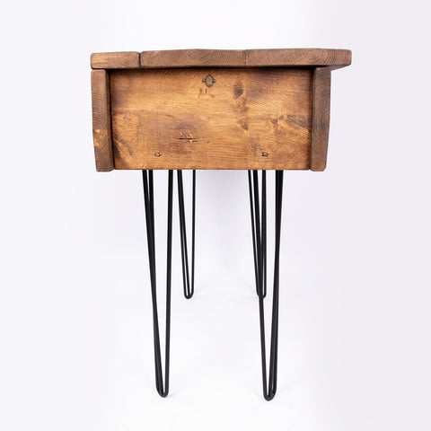 Rustic wooden blanket box with black hairpin legs used as a wooden blanket storage chest trunk