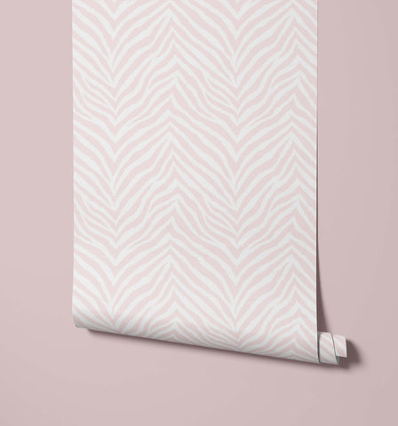 A roll of hakambo pale pink print wallpaper with subtle off-white zebra print wallpaper pattern