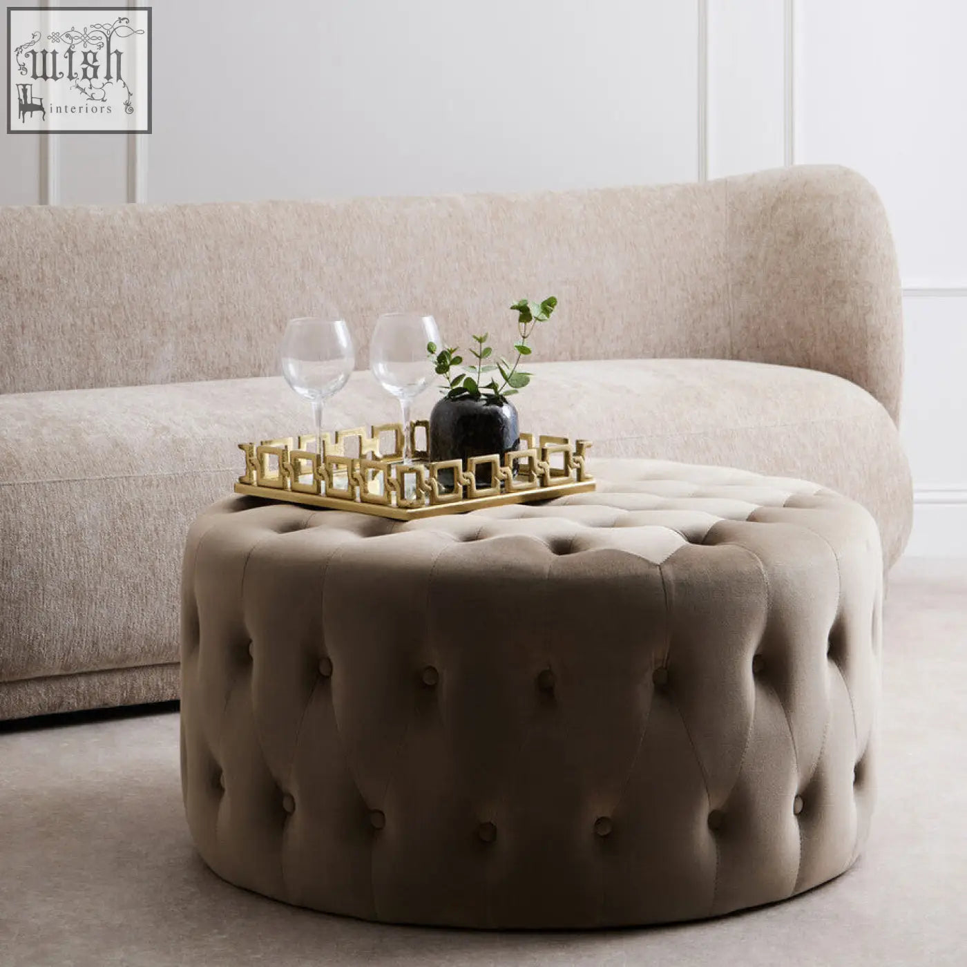 Beige haley mink velvet round tufted footstool with cushioned design and button detailing for comfy seating