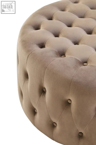 Beige mink velvet round tufted footstool with button detailing perfect for cozy living spaces