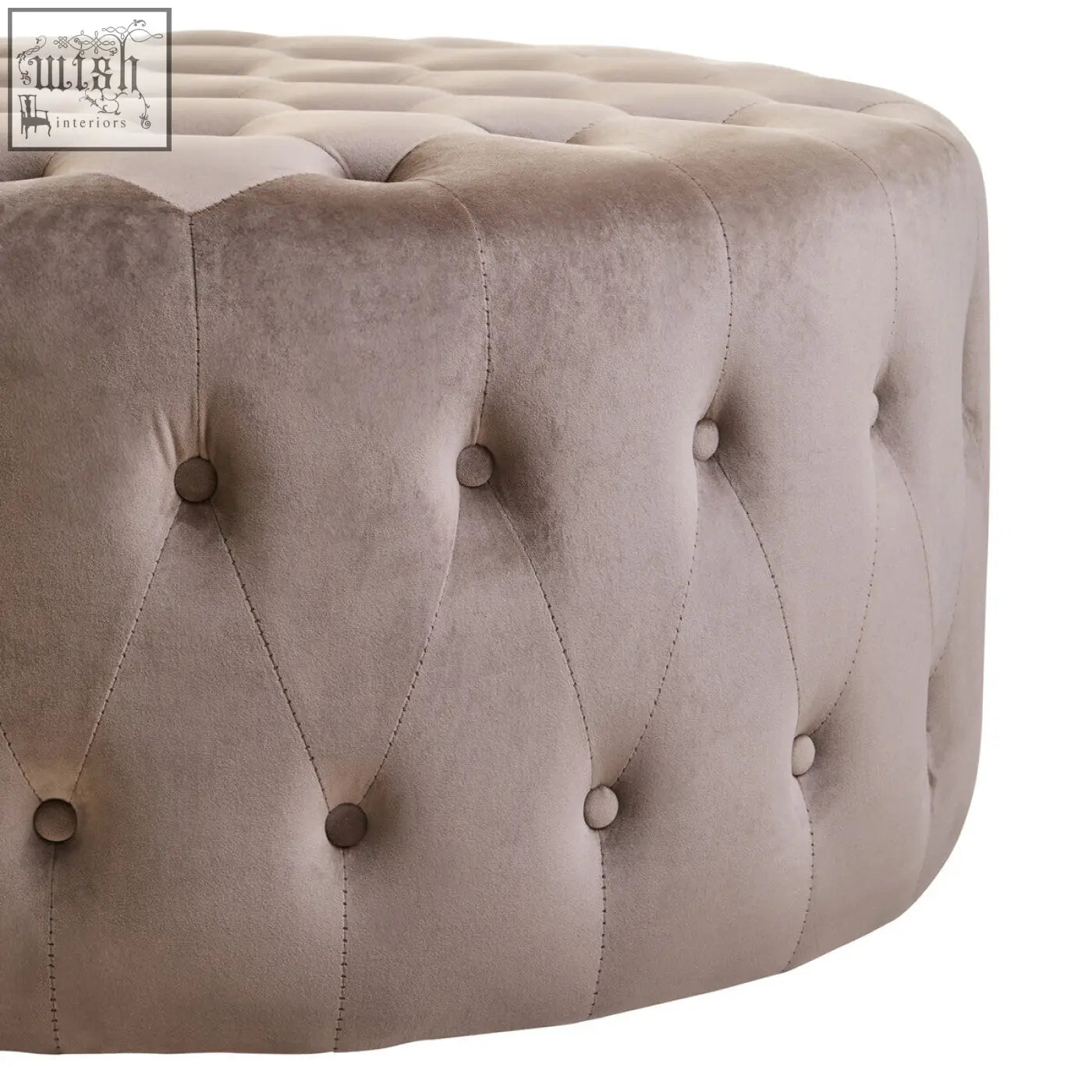 Beige mink velvet round tufted ottoman with matching button accents in the haley mink velvet round footstool design